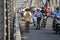 People on motorbikes on the road across the bridge in Hue town, Vietnam