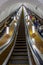 People on moving staircase in subway of Pushkinskaya Metro station in Moscow city