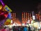 People on night illuminated street in Luoyang