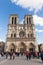 People at Notre Dame, Famous Catholic Church, Tourism Landmark in Paris France