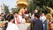 people offering food and items to a buddhist monk and being blessed in temple