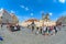 People in the Old Town Square the view on Tyn church and Jan Hus monument. Photo taken with a fisheye lens.