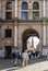 People at the ornate Golden Gate where the Long Lane starts at the Main Town Old Town in Gdansk