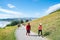 People outdoors taking morning walk up slope Mount Maunganui