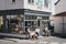 People at the outside tables of Grey Seal Coffee shop in Sheringham, Norfolk, UK