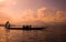 People paddle the boat in the lake