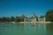 People paddling boats on pool in a park of Madrid