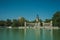 People paddling boats on pool in a park of Madrid