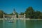 People paddling boats on pool in a park of Madrid