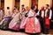 People parading in regional costumes in procession in Elche