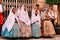 People parading in regional costumes in procession in Elche