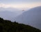 People parasailing in the sky over the mountains