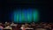 People, parents, the children in the auditorium before the show. Blue-green curtain. A theatrical production