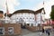 People passing near The Globe Theater in London