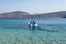 People on the pedal boat on the beach between the Twin Islands of Ksamil in Albania