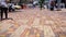 People pedestrian walking outdoor in city floor sidewalk paviment Brazil Londrina legs