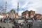 People and pigeons around the New Mosque courtyard