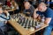 People play chess during chess competition in chess club. Education, chess and mind games.