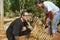 People play with indochinese baby tiger in Saiyok, Thailand.