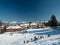 People play in the snow in a small mountain village