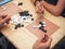 People playing chinese boardgame. People Playing Mahjong Asian Tile-based Game. Table Gambling top viewThe game of go