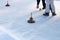 People playing curling on a frozen lake, Austria, Europe