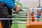 People playing foosball table soccer. Team sport, table football players. Competitive table game