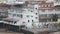 People playing football outside of shanty houses.