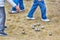 People playing petanque fragment, metal balls on sand
