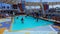 People playing at pool at upper deck in mini volleyball at cruise at cruise liner or ship