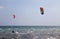 People practice kitesurfing in the Ligurian sea, rough sea, Genoa, Italy