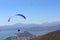 People practicing paragliding over the lake of valle de bravo, mexico X