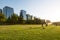 People practicing sports at Parque Araucano, the main park in Las Condes district, surrounded by office buildings of Nueva Las Con