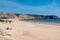 People in Praia da Mareta in the turistic city of Sagres in the Algarve, Portugal in the summer of 2022