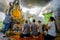 People that pray homage to public ancient Thai Buddha statue left in temple for hundred years