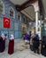 People praying in front of the tomb of Abu Ayyub al-Ansari at Eyup Sultan Mosque, Istanbul, Turkey