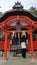 People praying at Fushimi Inari Shrine in Kyoto, Japan