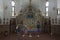 People praying in a temple in honor of the icon Mother of God Semistrelnaya in the Trinity-Georgievsky female monastery