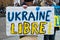 People protesting against the war with ukrainian flags with textin french : Ukkraine libre, in english : free Ukraine