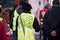 people protesting with yellow vest with text against the government reforms