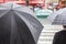 People with rain umbrellas in the rainy city