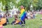 People with rainbow flags at Pride picnic event at Pride Village, Prague Pride festival