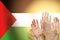 People raising hands and flag palestina on background. Patriotic concept