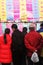 People read good luck messages in China. Chinese New Year celebrations for the Year of the Pig.