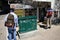 People reading the news at a press kiosk in Athens, Greece