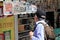 People reading the news at a press kiosk in Athens, Greece