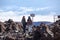 People reading the warning message on alpine pathway in mountains, the Teide peak, Tenerife island, Canary, Spain