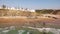 People relax on the beach Zambujeira de Mar near the rocks aerial view