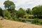 People relax and fish during the lockdown in London in Victoria park Tower Hamlets while social distancing