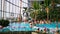 People relax in the pool with thermal water at Therme Bucharest, Romania.